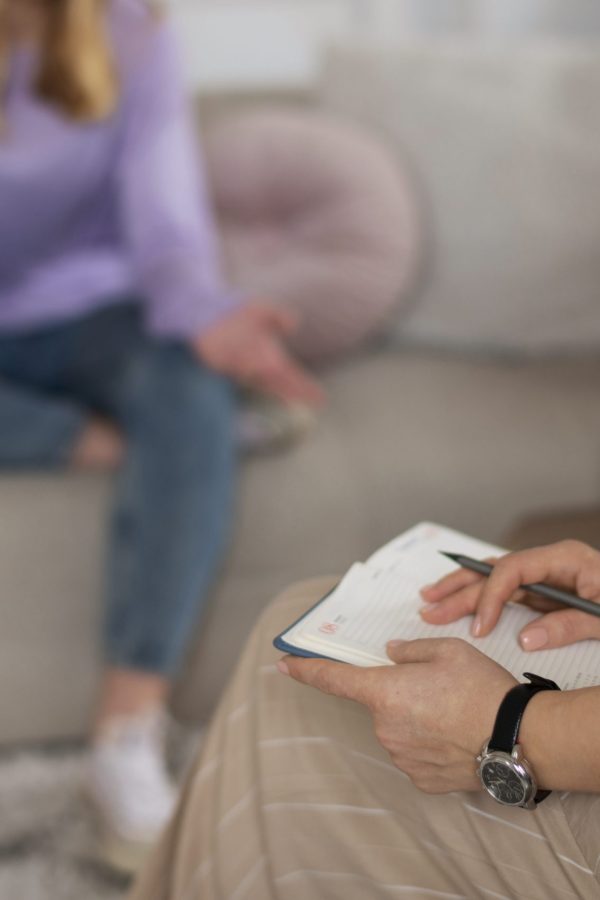 side-view-young-girl-talking-therapist-scaled-1.jpg